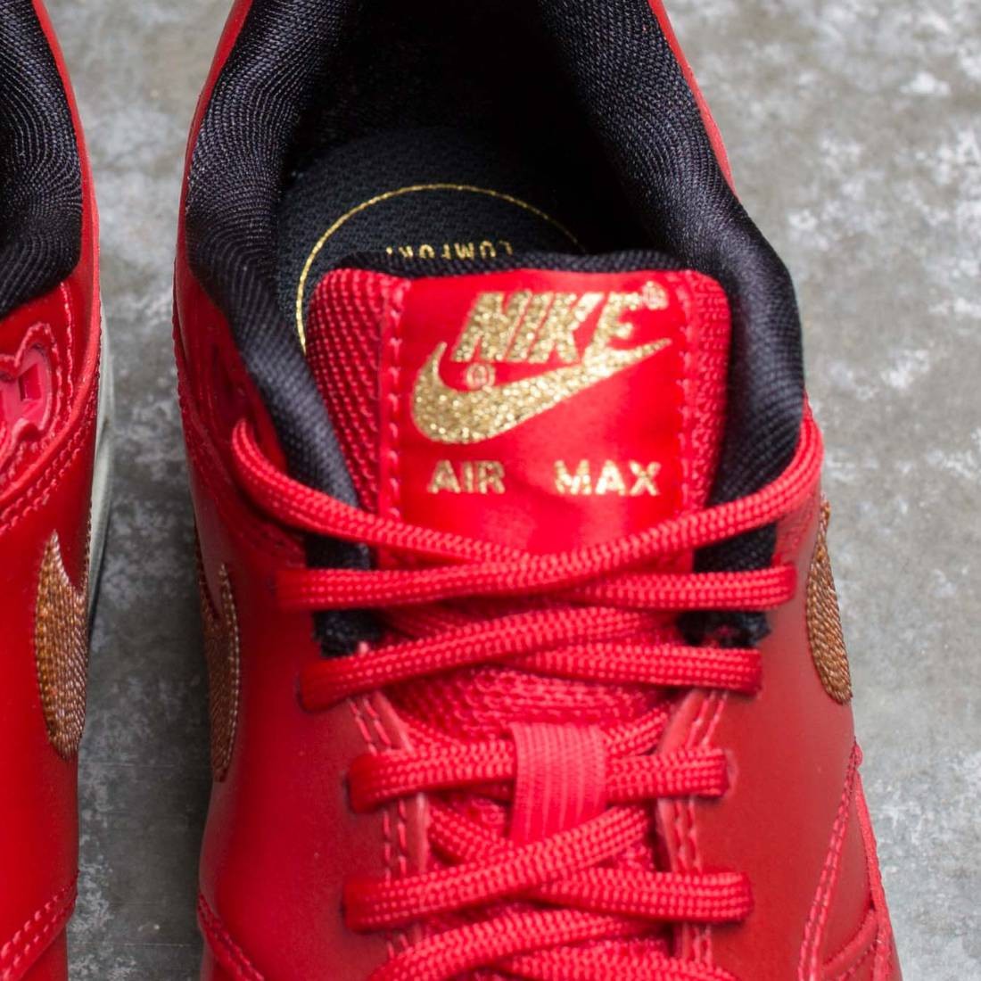 gold black and red air max